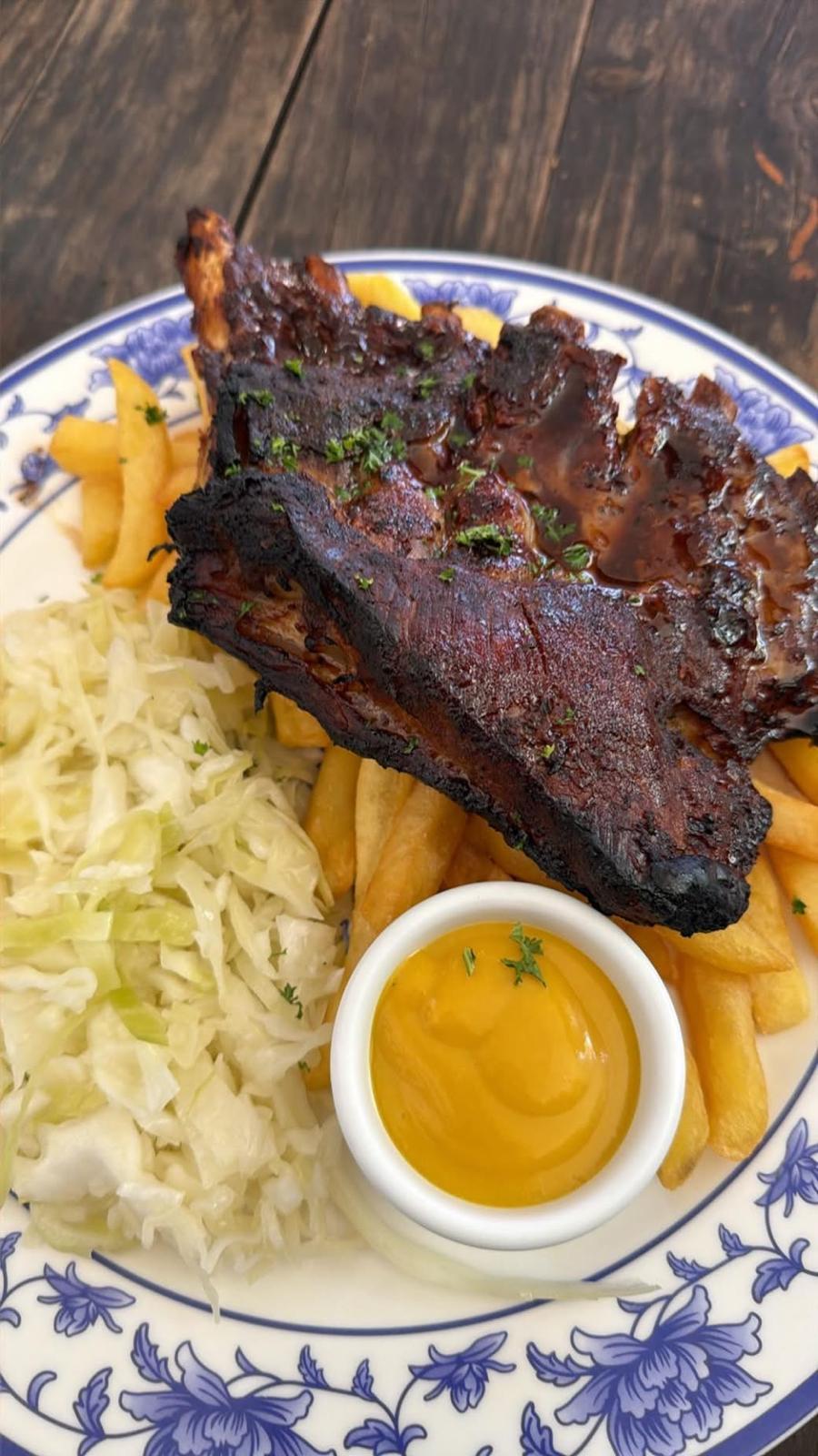 House-marinated pork ribs with chips, cabbage salad and honey mustard sauce